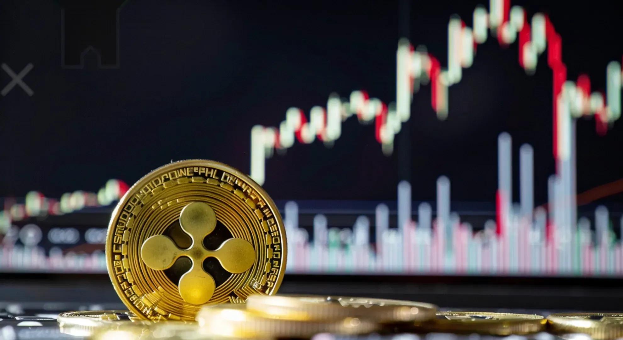 Photography of a financial chart showing a sharp rise followed by a potential pullback, with XRP cryptocurrency symbol in the foreground